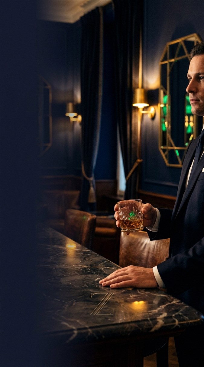 Casino player at table with cards and chips